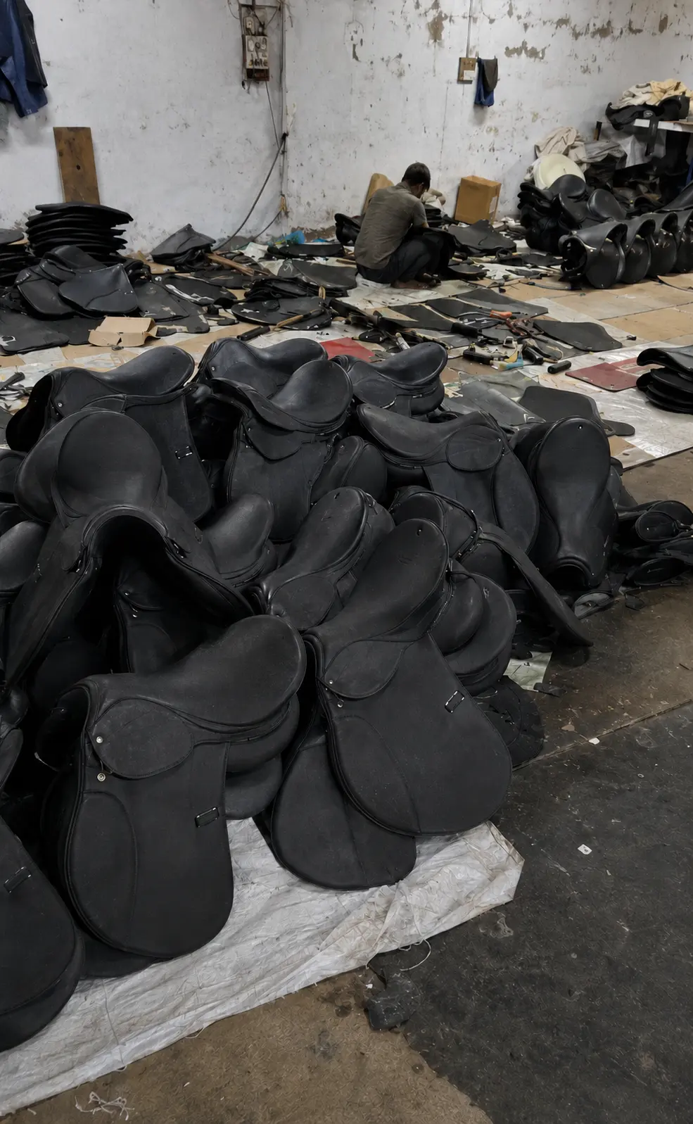 Black English saddles on the HideOrax production floor