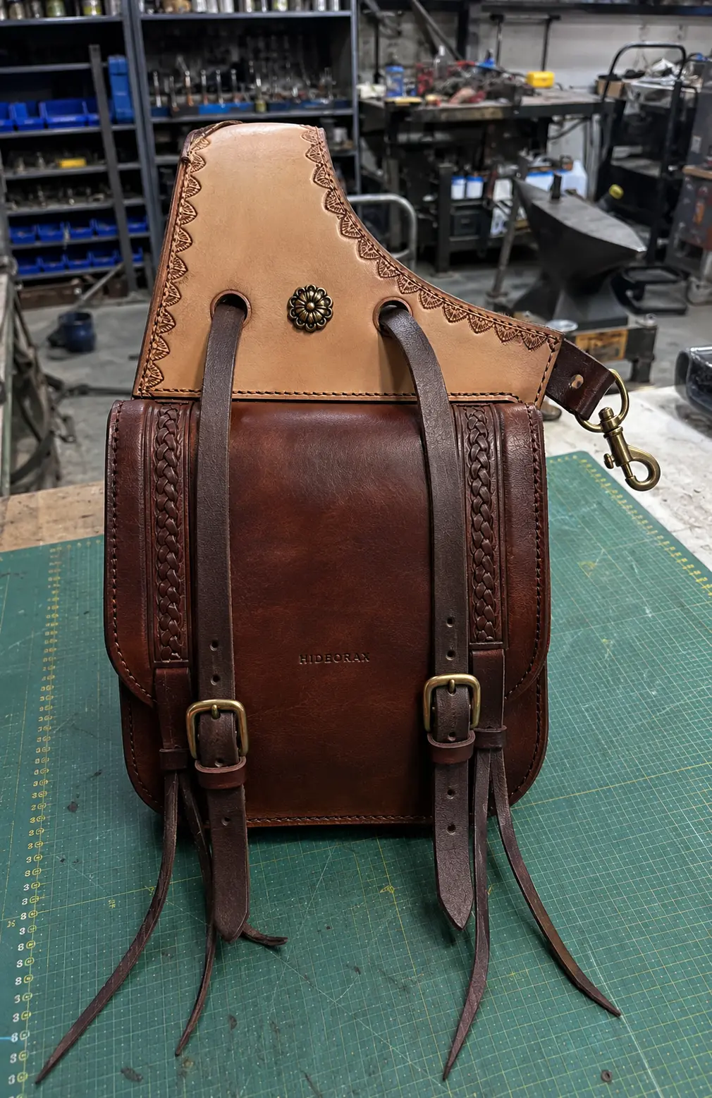 Two-tone leather saddle bag inspected in the workshop
